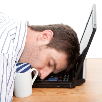 Businessman Asleep At His Computer