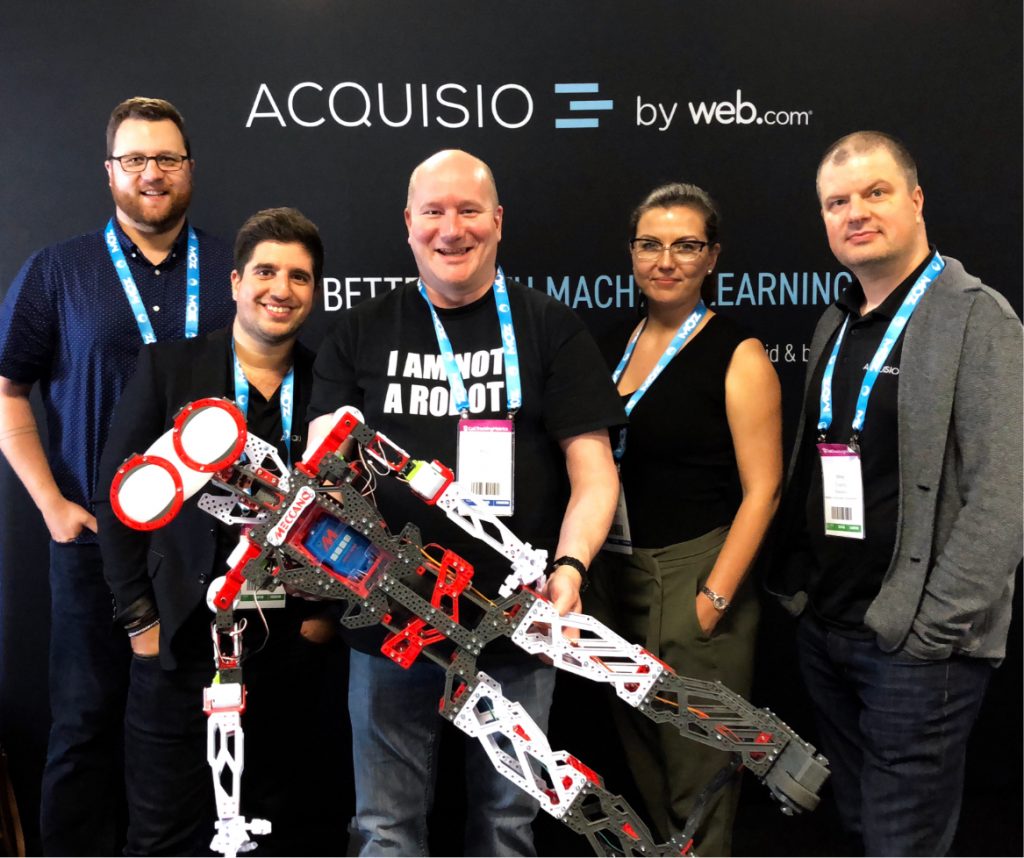 Acquisio team at a trade show: I am not a robot